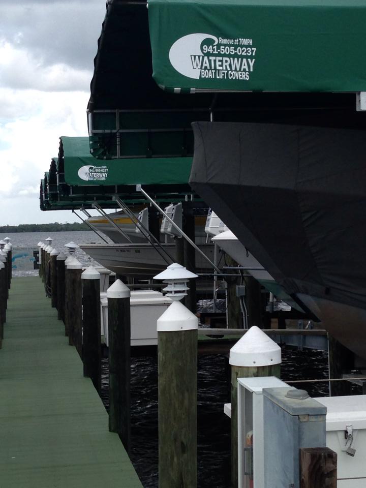 Waterway boatlift canopies installed by the dock